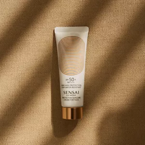 Silky Bronze Protective Suncare Cream for Face bottle shown with summer mood lighting